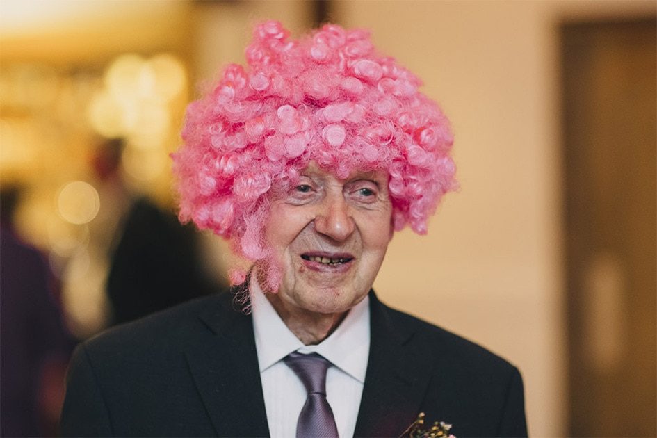 Pink wig on a wedding guest.