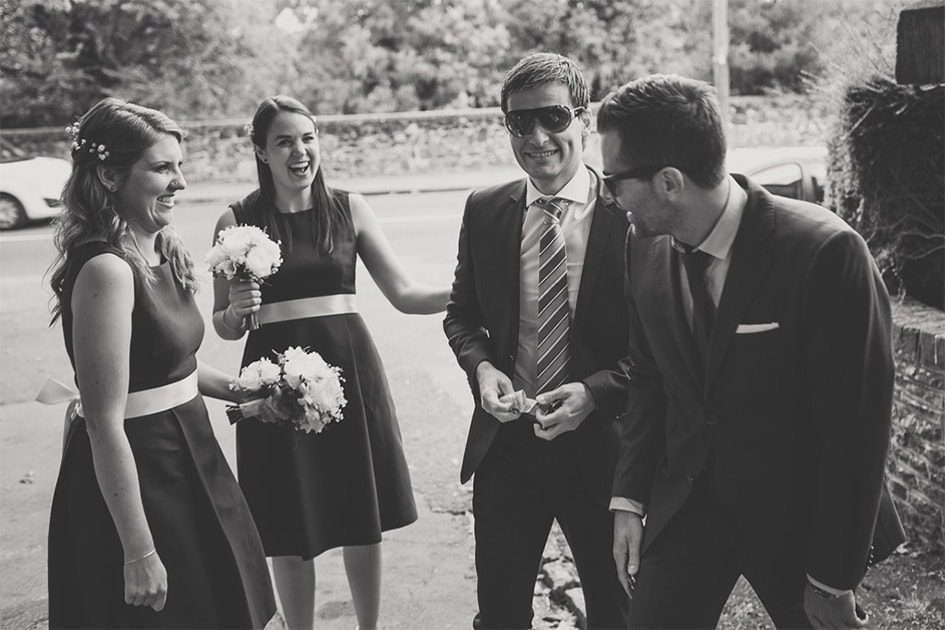 Guests laughing at a wedding.