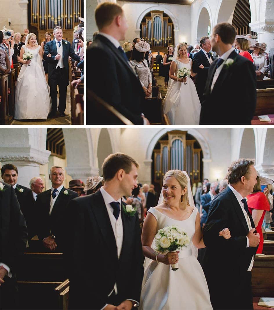 Bride walks down the aisle and see her husband to be in a church.