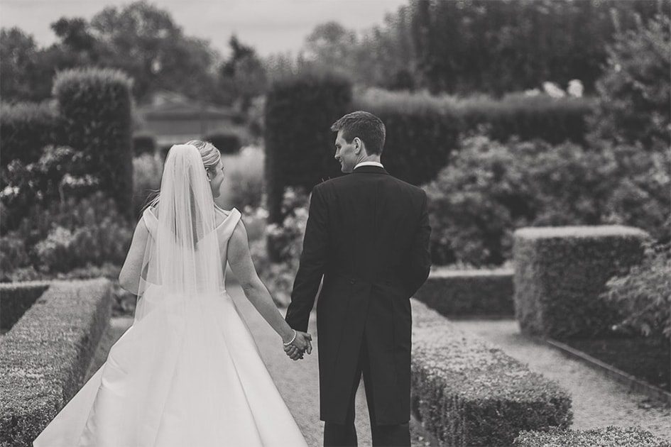 A couple walking together on their wedding day.