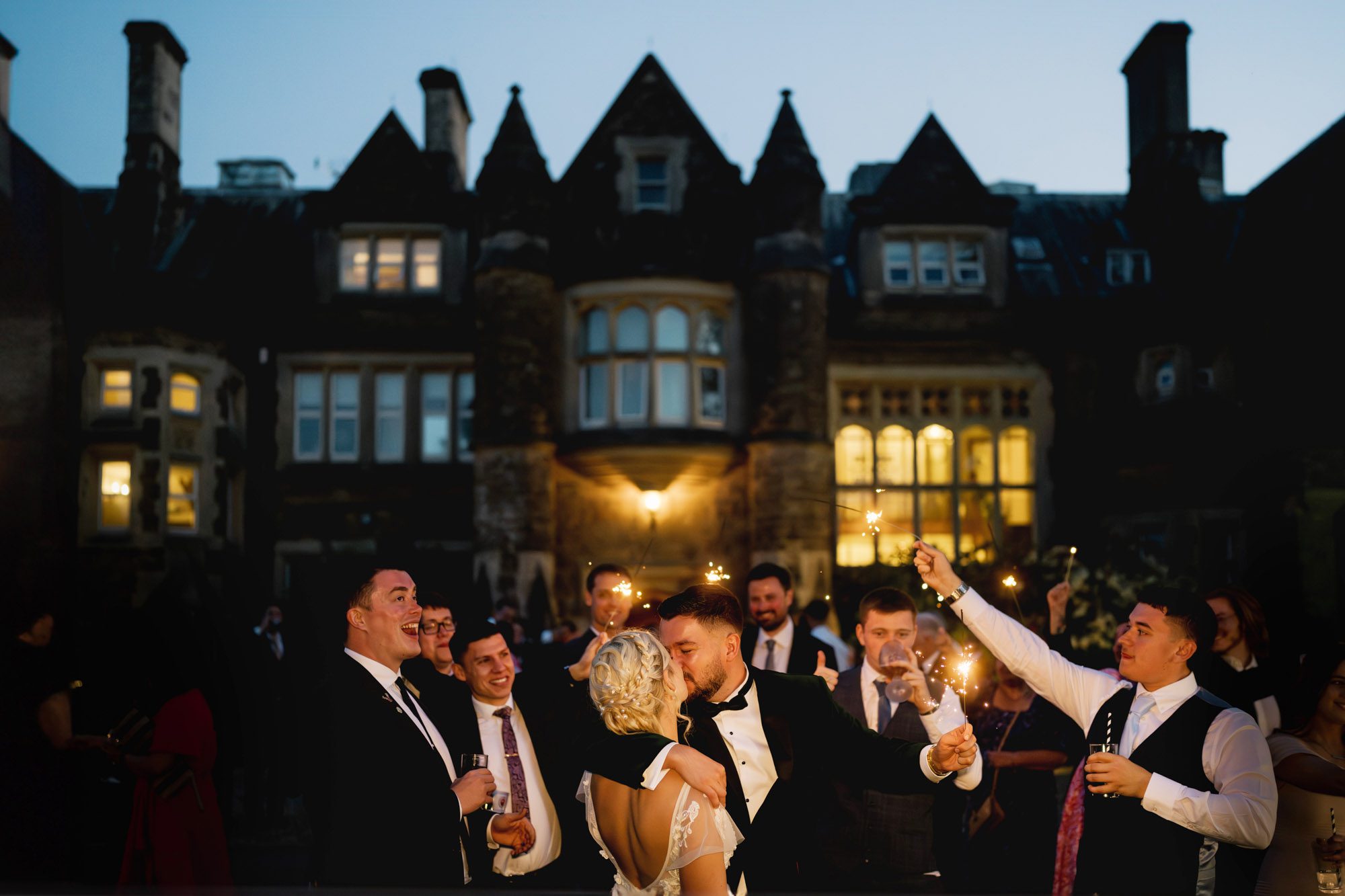 Bride and groom kiss after a sparkler exit at Hartsfield Manor.