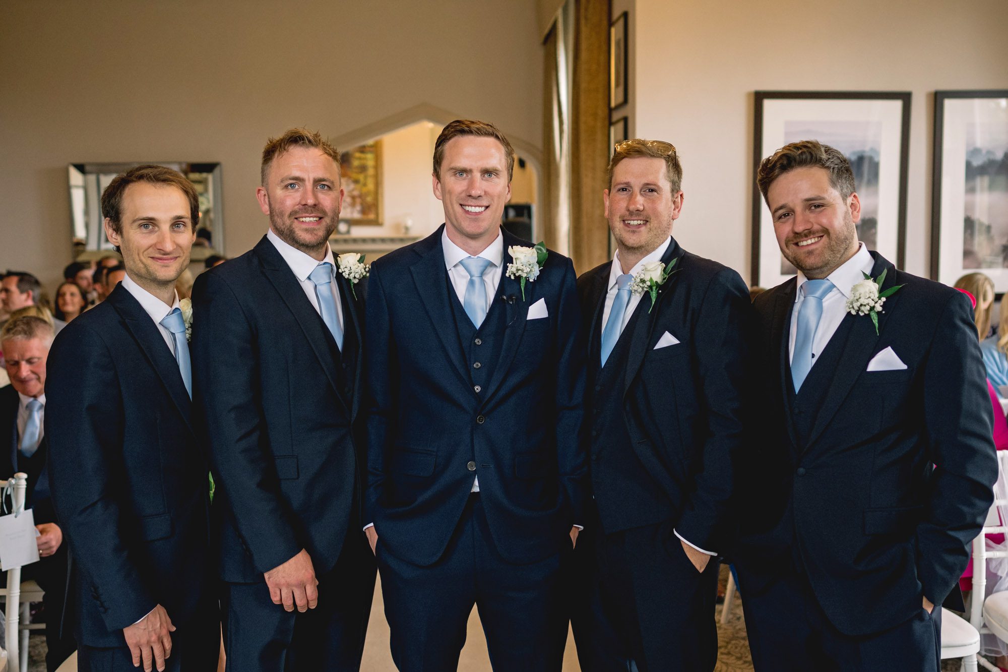 The groom and groomsmen at in the lounge at Hartsfield Manor.