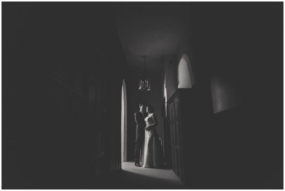 Bride and groom in the shadows.