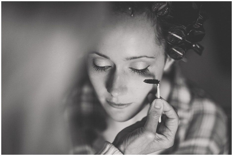 Dramatic photo of make up being applied.