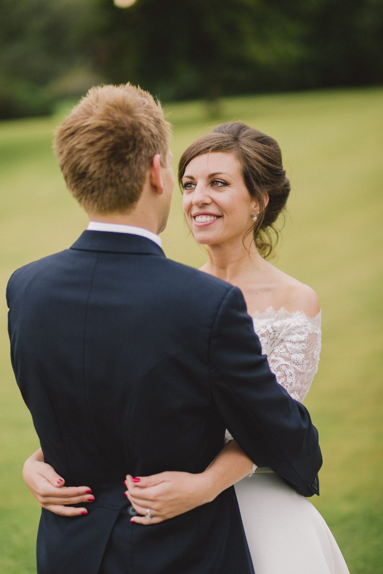 Bride and groom stare lovingly in to each other's eyes on their wedding day at Ashdown Park Wedding Venue in Sussex.