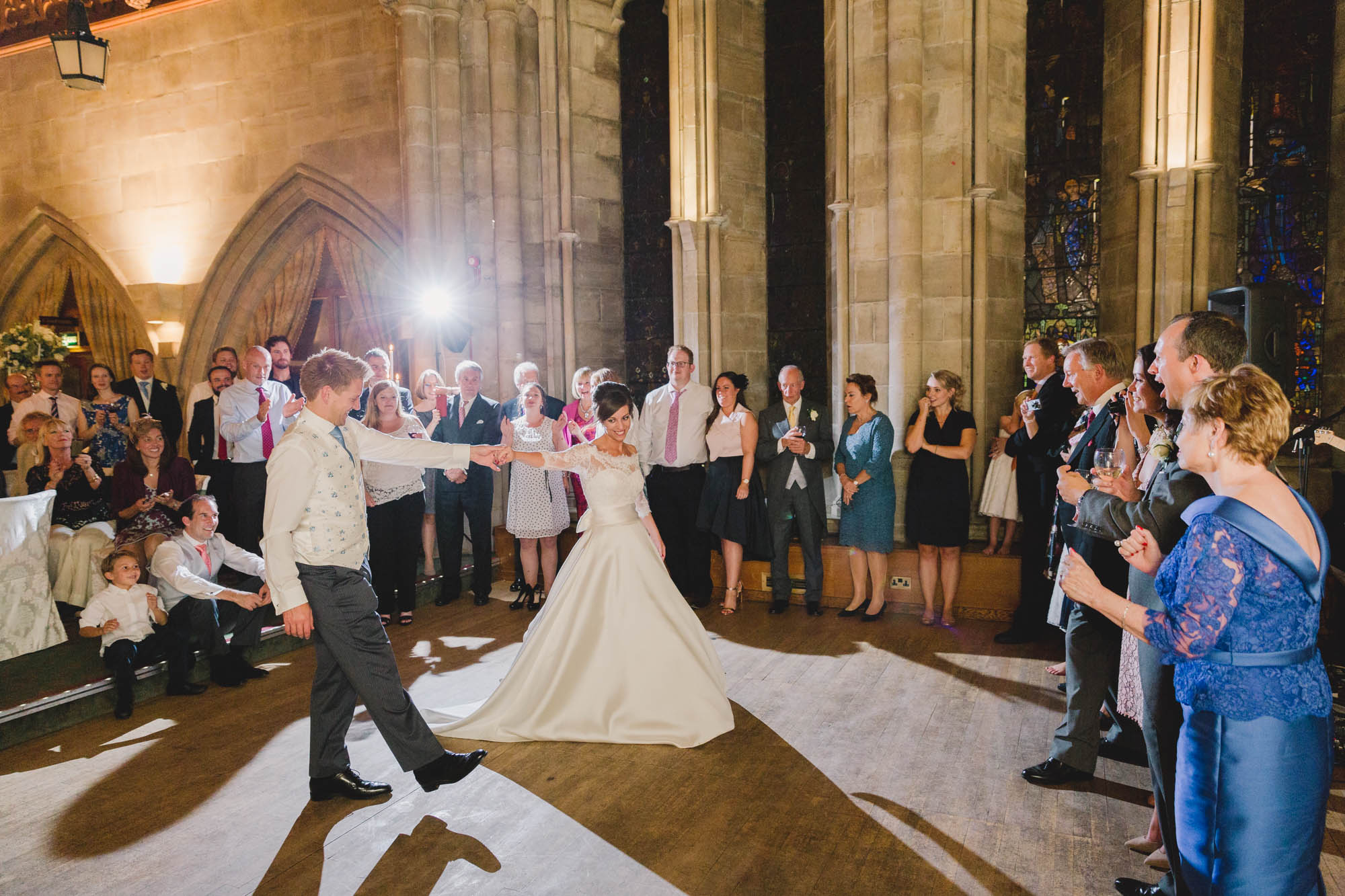 Bride and groom have their first dance together on their wedding day at Ashdown Park.