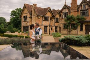 Bride and Groom kiss on their wedding day at Dorney Court in Buckinghamshire.