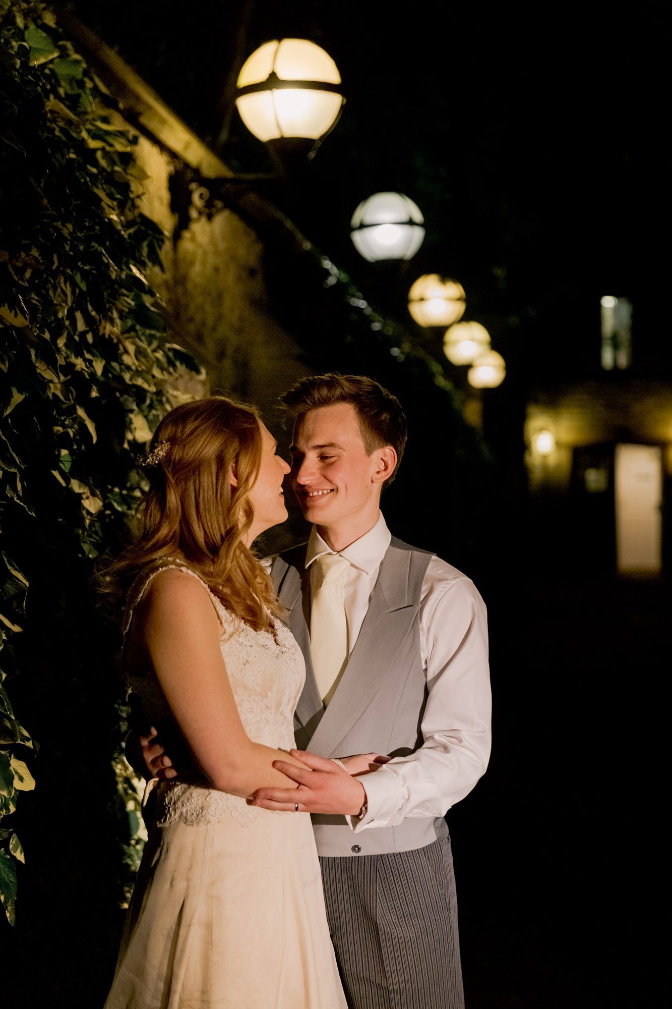 Bride and groom laugh together on their wedding day at Nutfield Priory Wedding Venue in Surrey.
