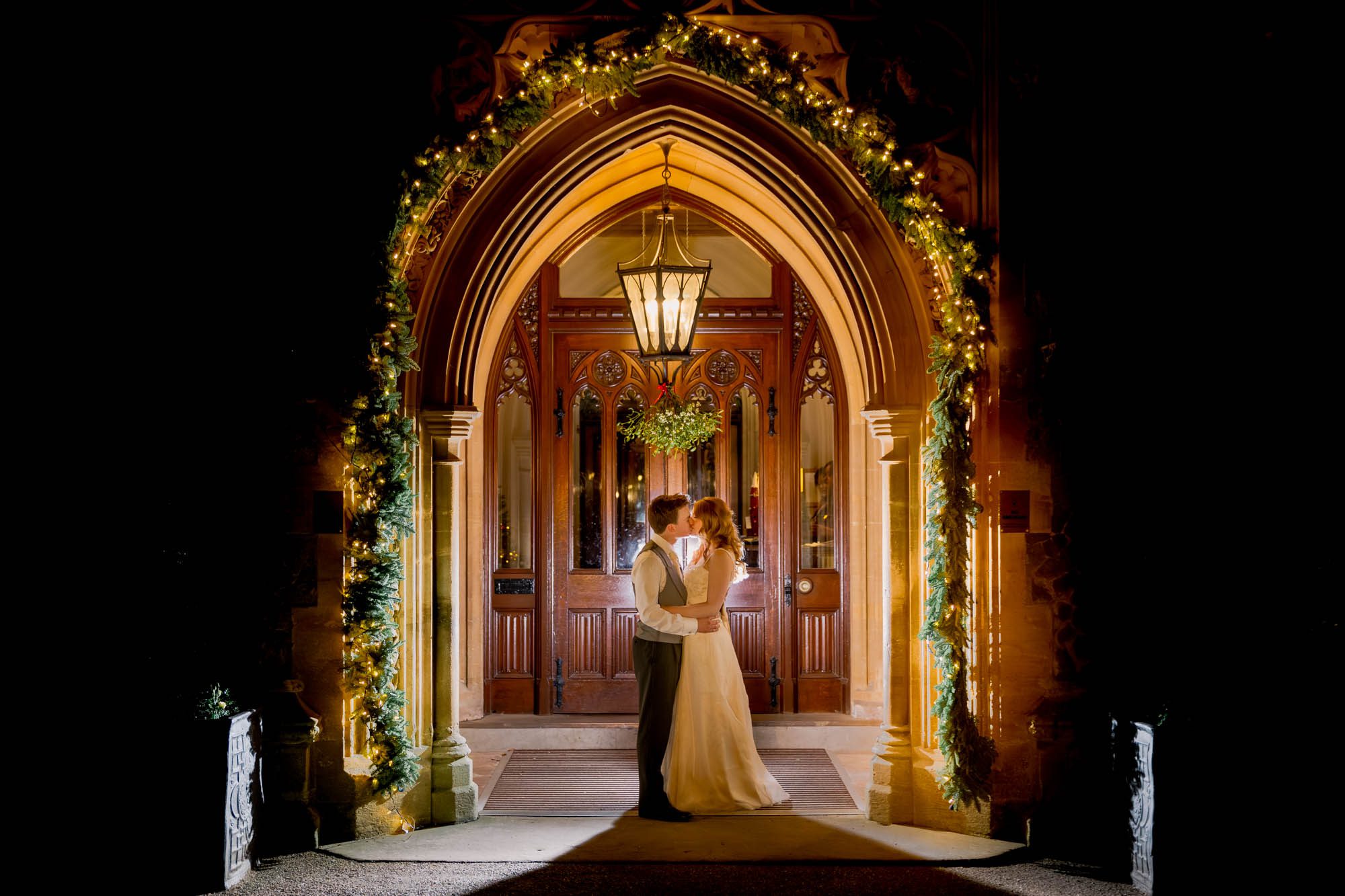 Bride and groom kiss on their wedding day at Nutfield Priory Wedding Venue in Surrey