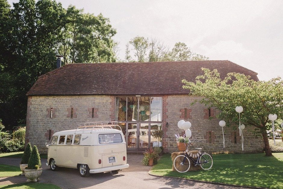 Bartholomew Barn in Sussex with sun shining.