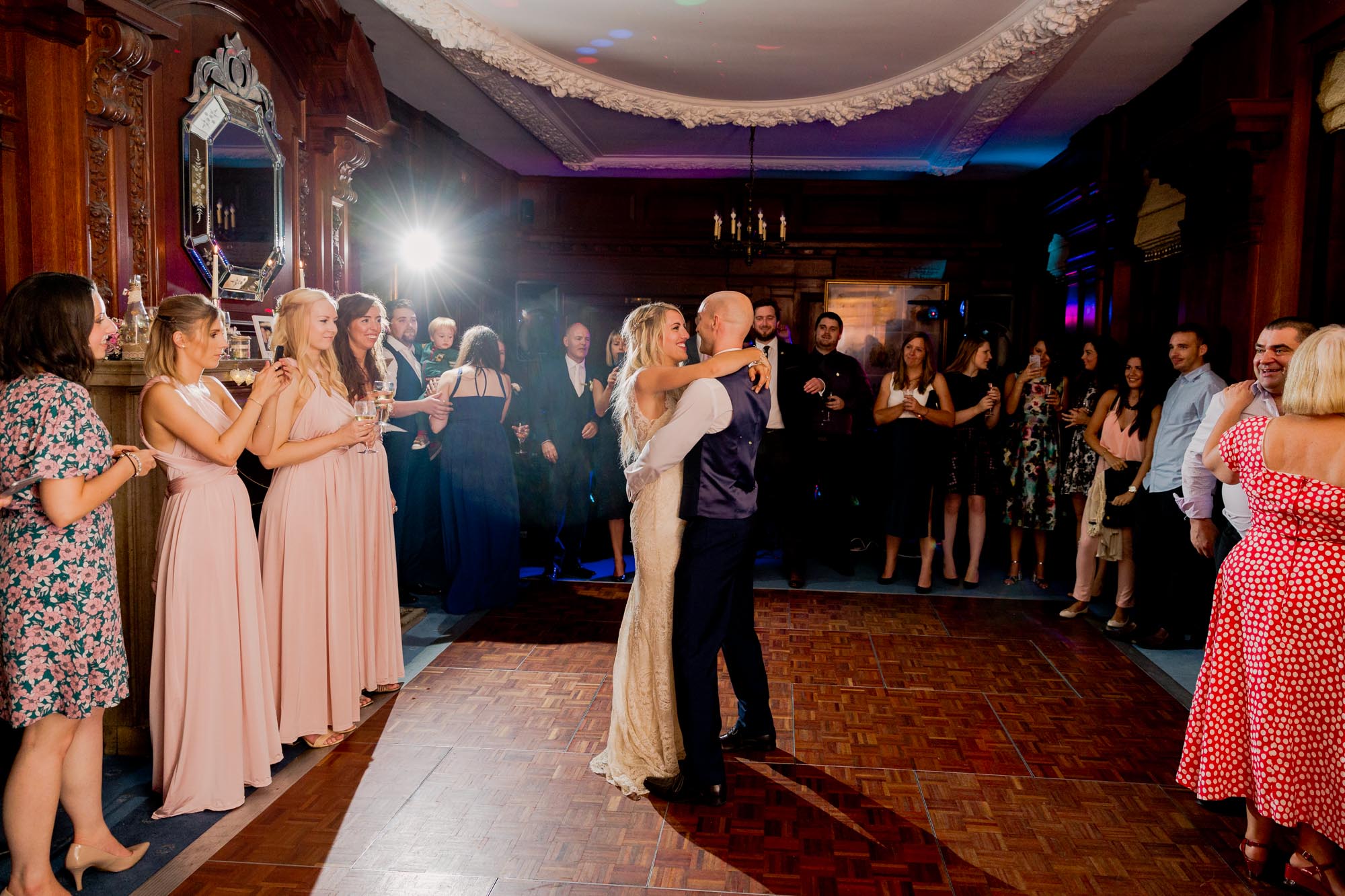 Bride and groom have their first dance together on their wedding day at Barnett Hill in Surrey.