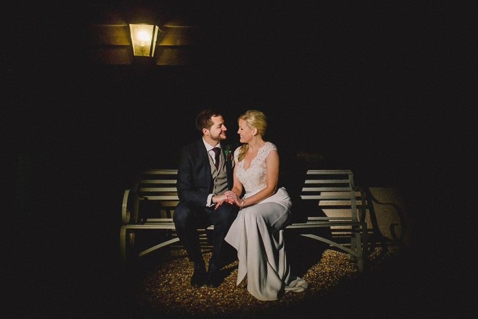 Bride and groom at night in Gate Street Barn