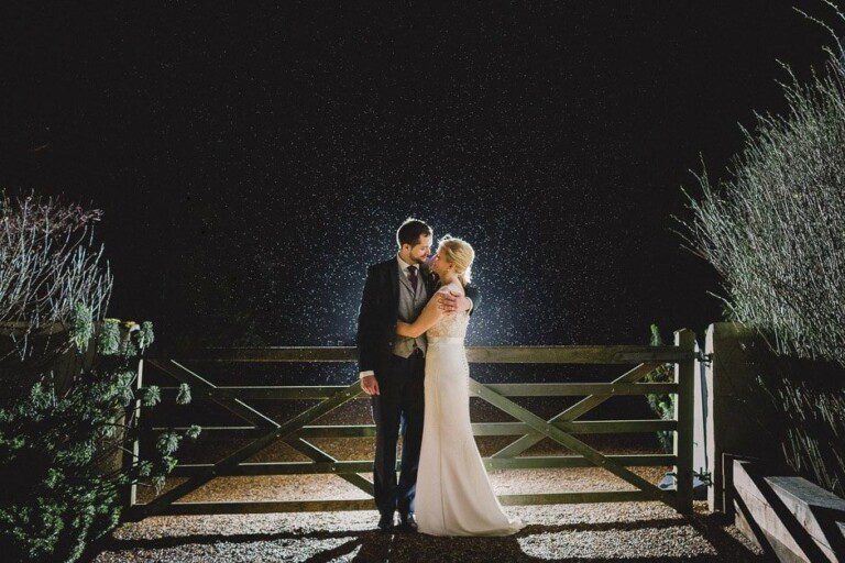 Bride and Groom hug under the stars at Gate Street Barn.