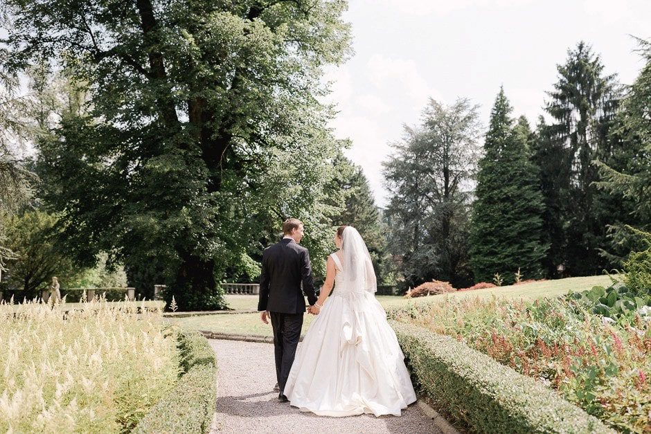 St Charles Hall Wedding with bride and groom walking in the gardens.