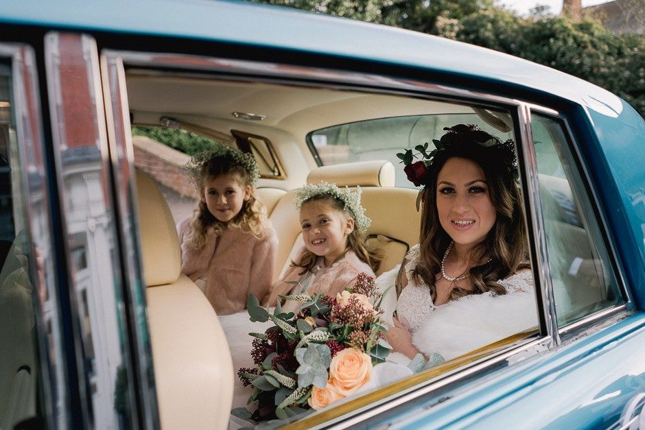 Leatherhead Register Office wedding with bride rriving in a car.
