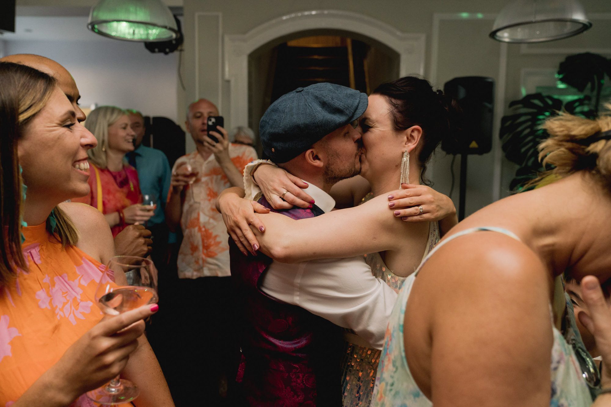 Bride and groom kiss during their first dance at a wedding at Palm Court Pavilion in Beach House Park in Worthing.