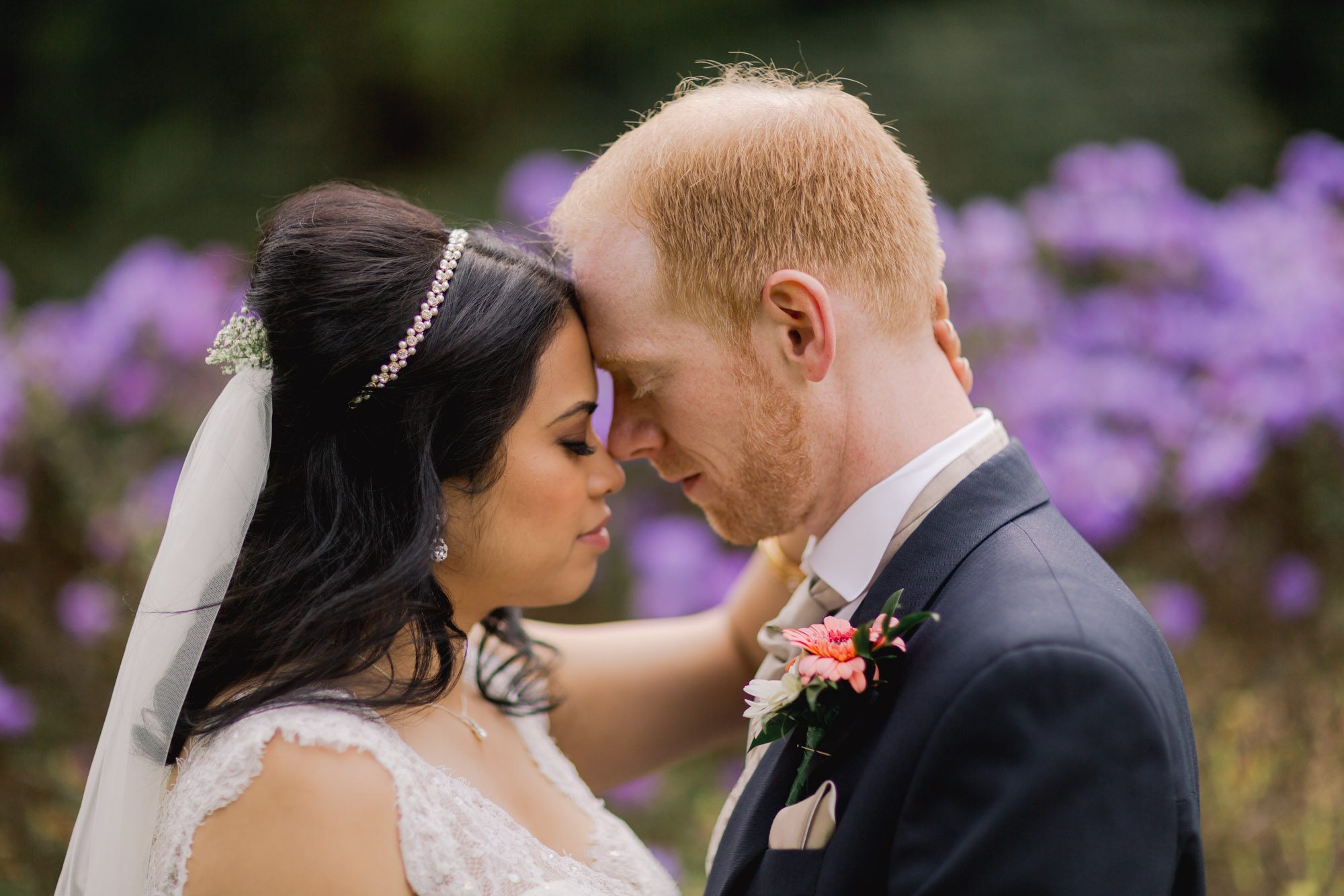 Bride and groom cuddle on their wedding day at Wotton House Hotel.