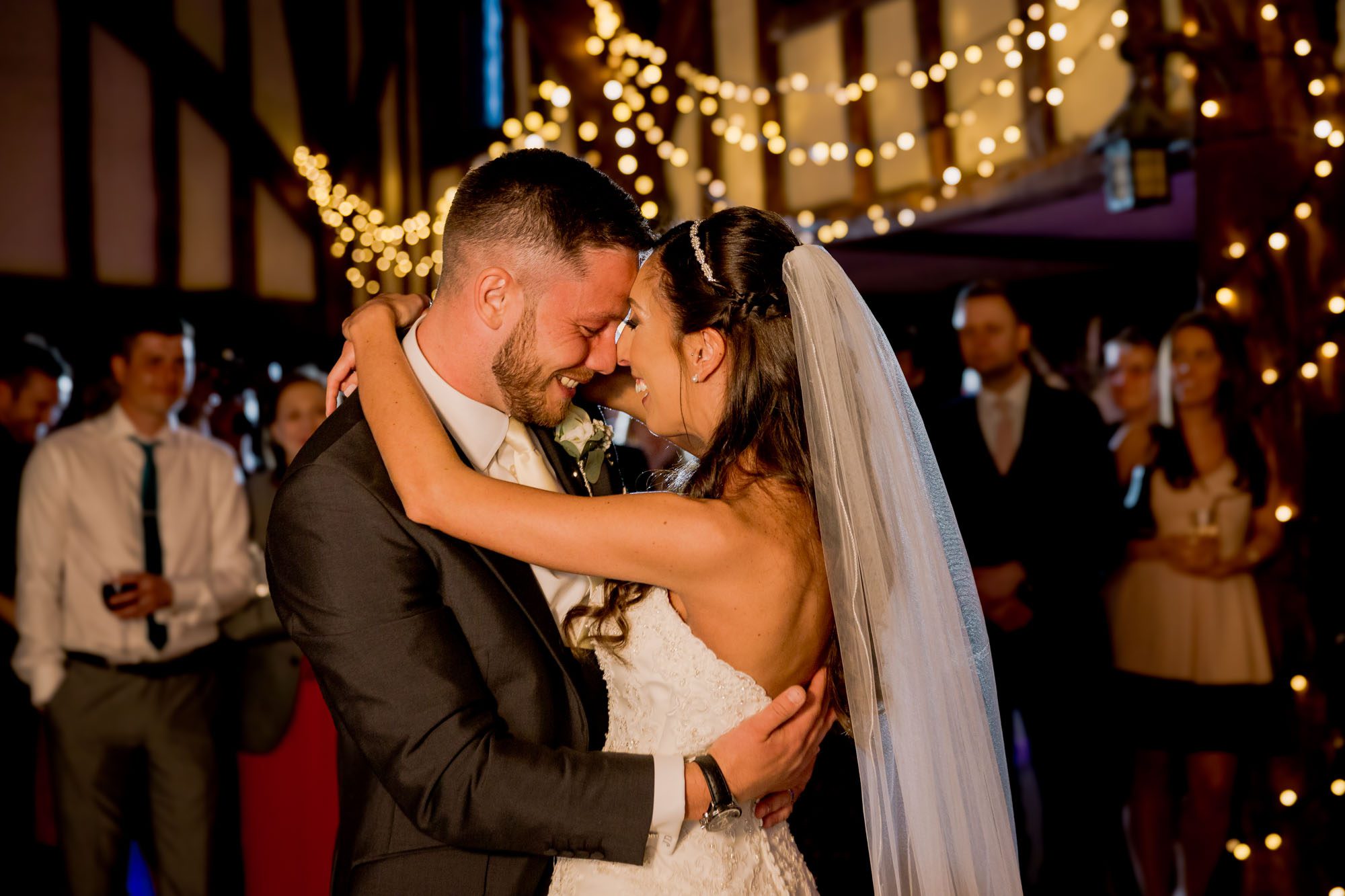 Bride and groom have their first dance together on their wedding day at Great Fosters.