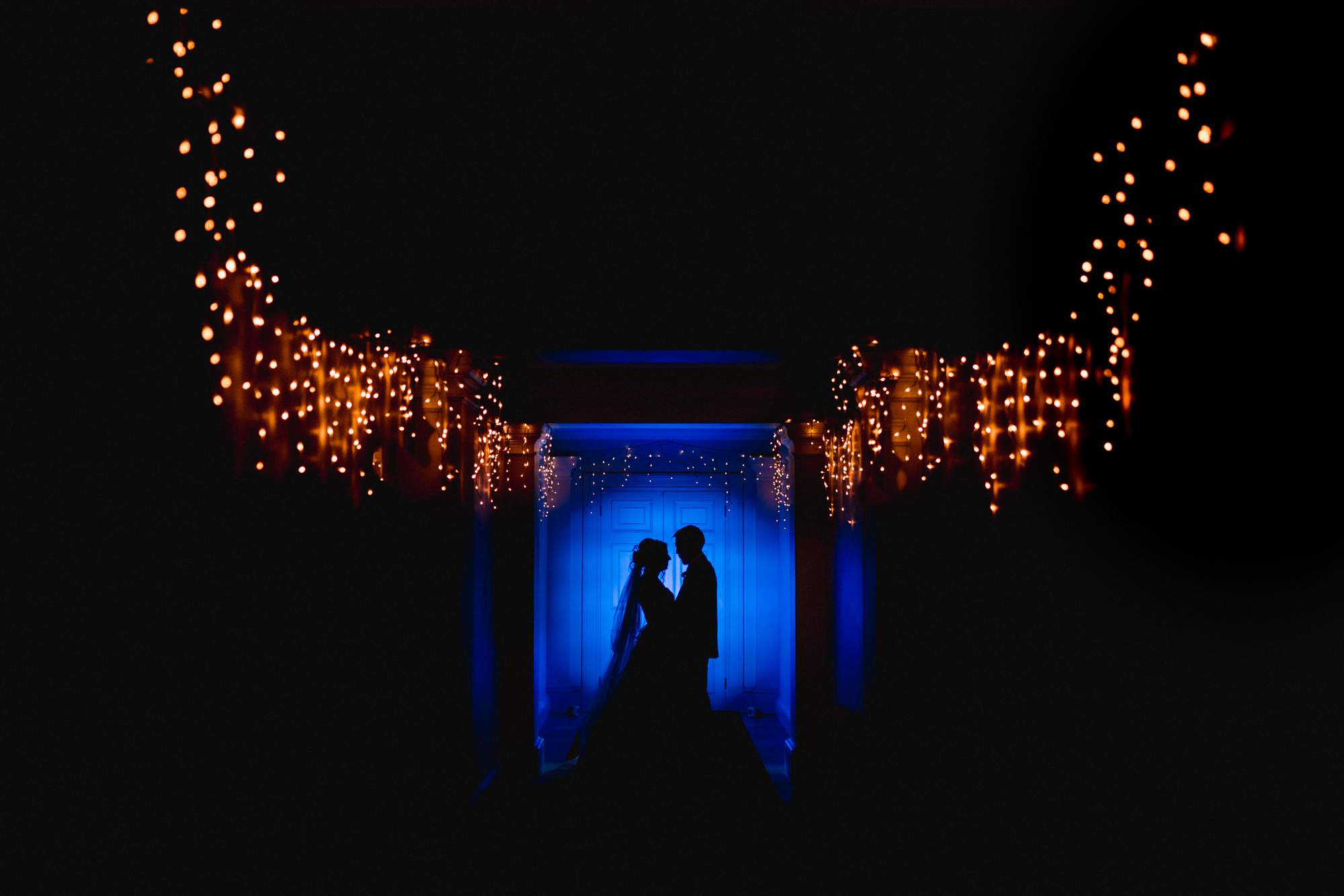 Silhouetted Bride and Groom at Buxted Park Wedding Venue in Sussex