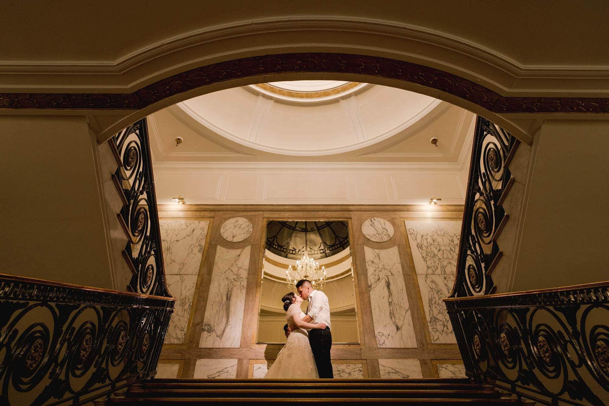 Bride and Groom kissing at Porchester Hall in London