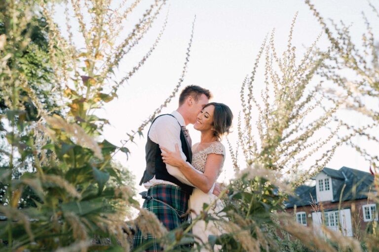 Bride and groom on their wedding day at Bury Court Barn in Surrey