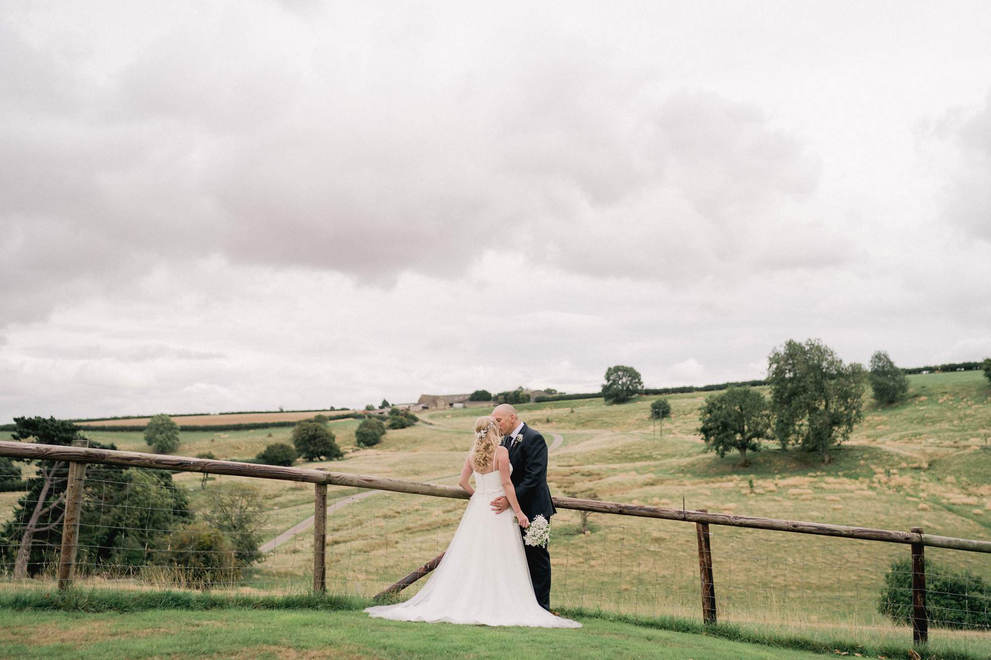 Bride and groom on their wedding day at Kingscote Barn in Gloucestershire