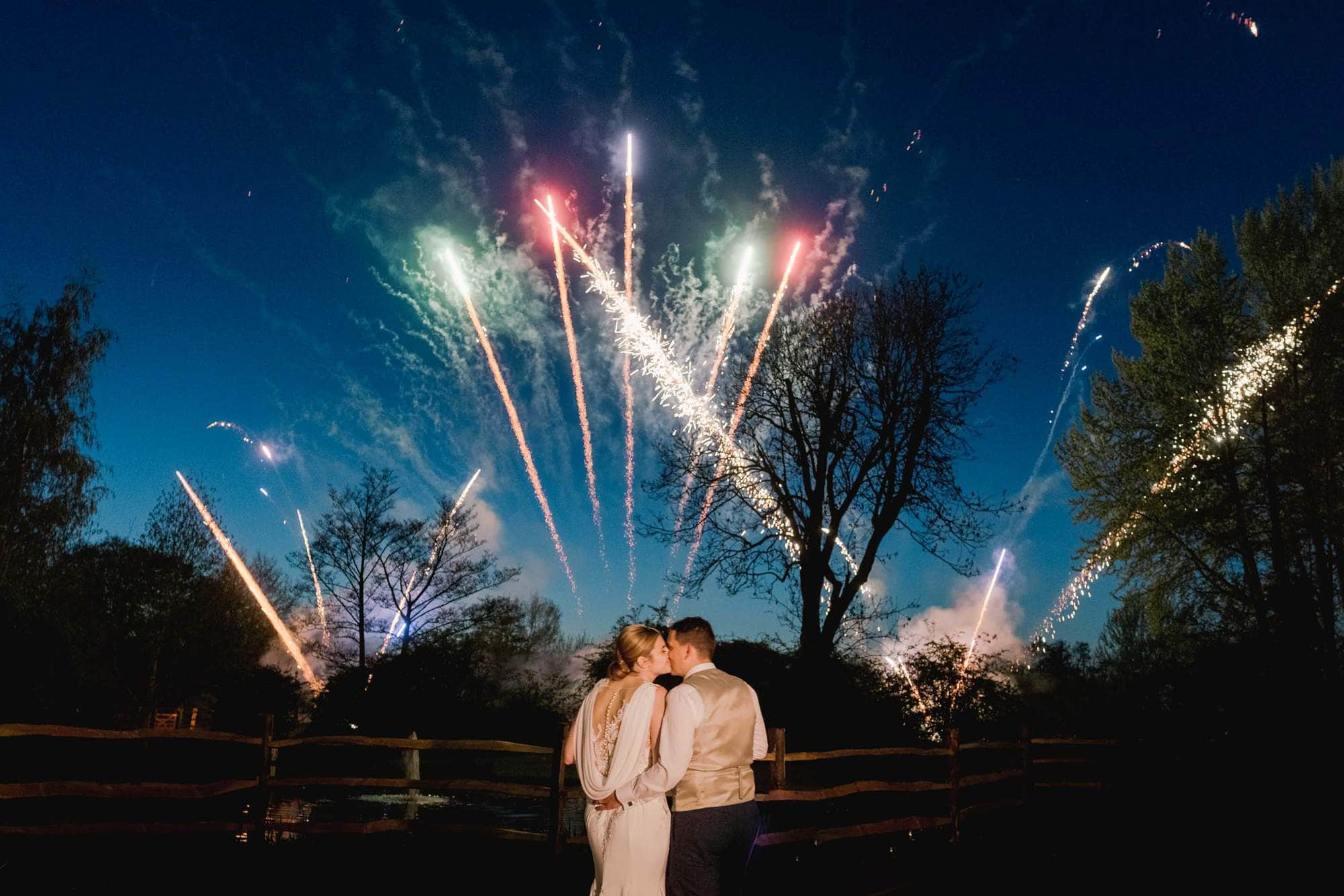 Bride and Groom Watching Fireworks at Coltsford Mill in Surrey