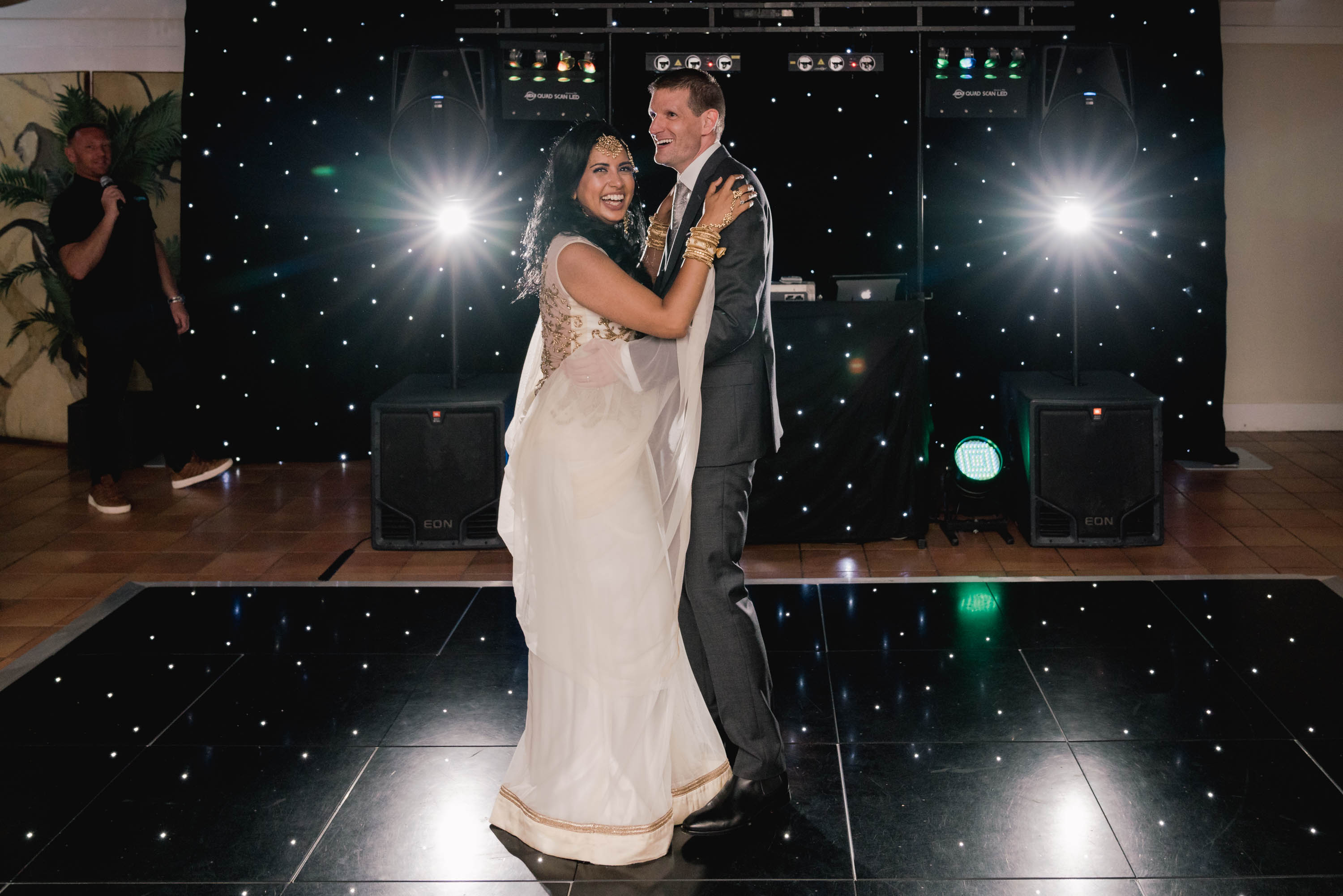 Bride and groom have their first dance together on their wedding day at Port Lympne Safari Park in Kent.