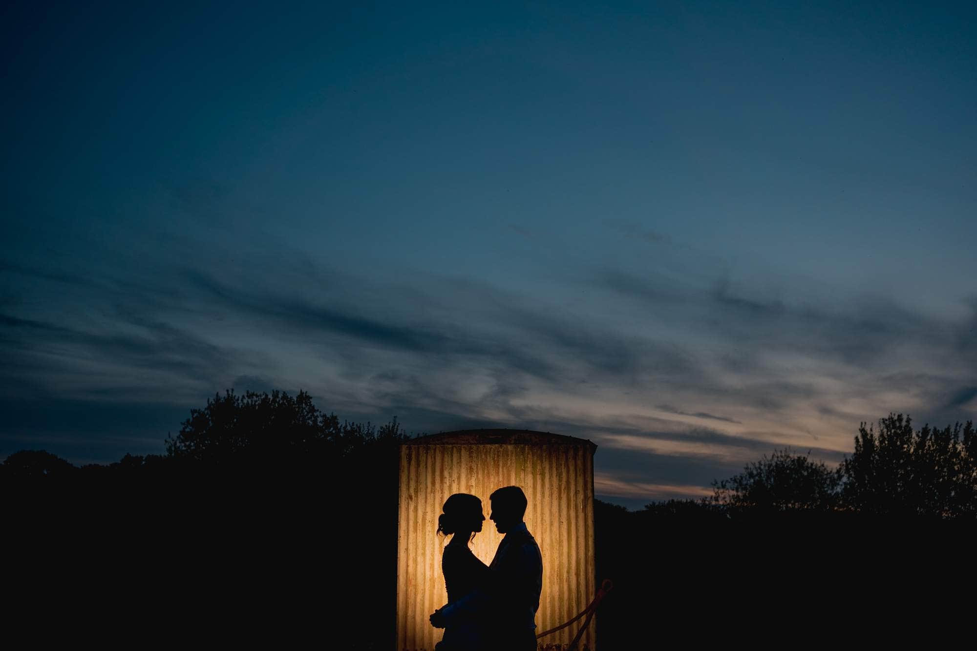 Silhouettes at old Greens Barn wedding.