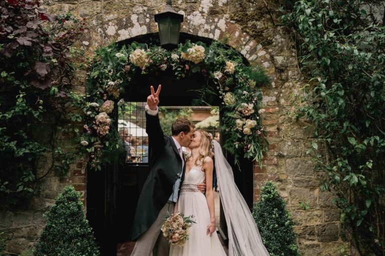 Bride and groom on their wedding day at Ramster Hall in Surrey