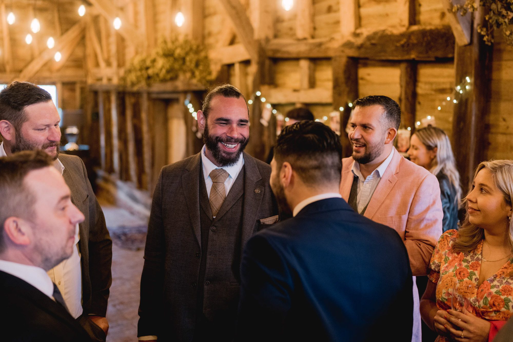 A guest smiling at a wedding.