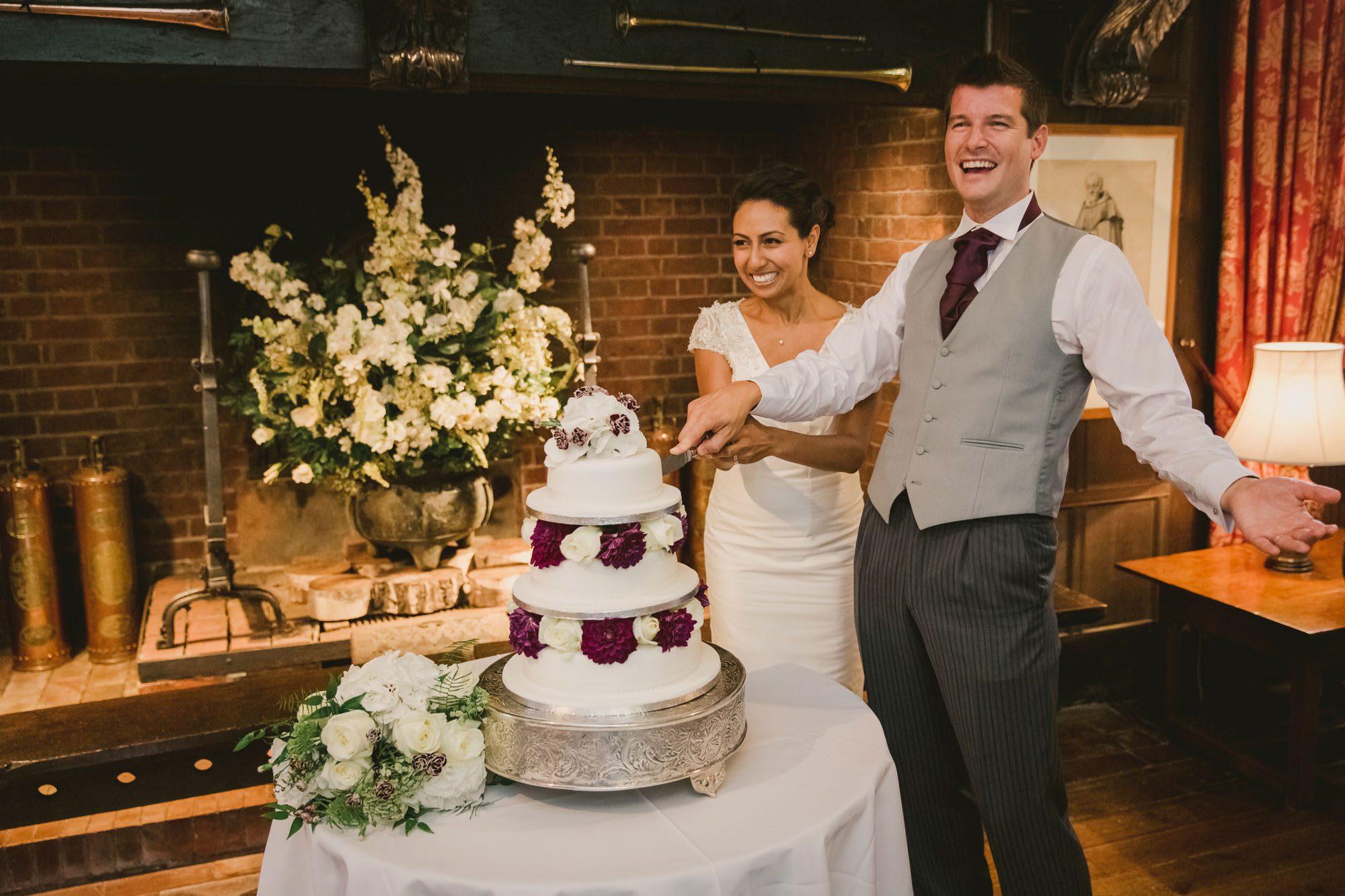 Bride and Groom cut the cake at Ramster hall.