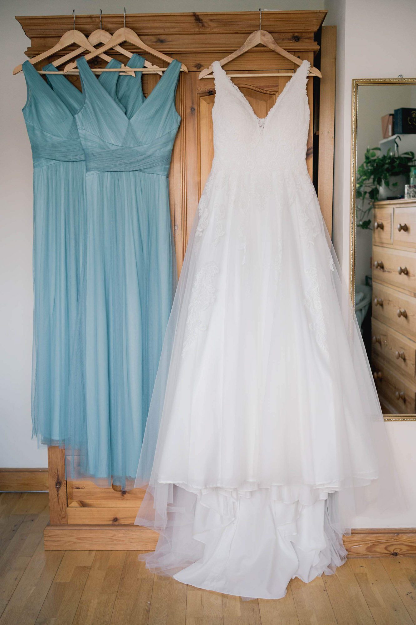 Brides dress hanging up ready for her wedding at Salomons Estate in Tunbridge Wells.