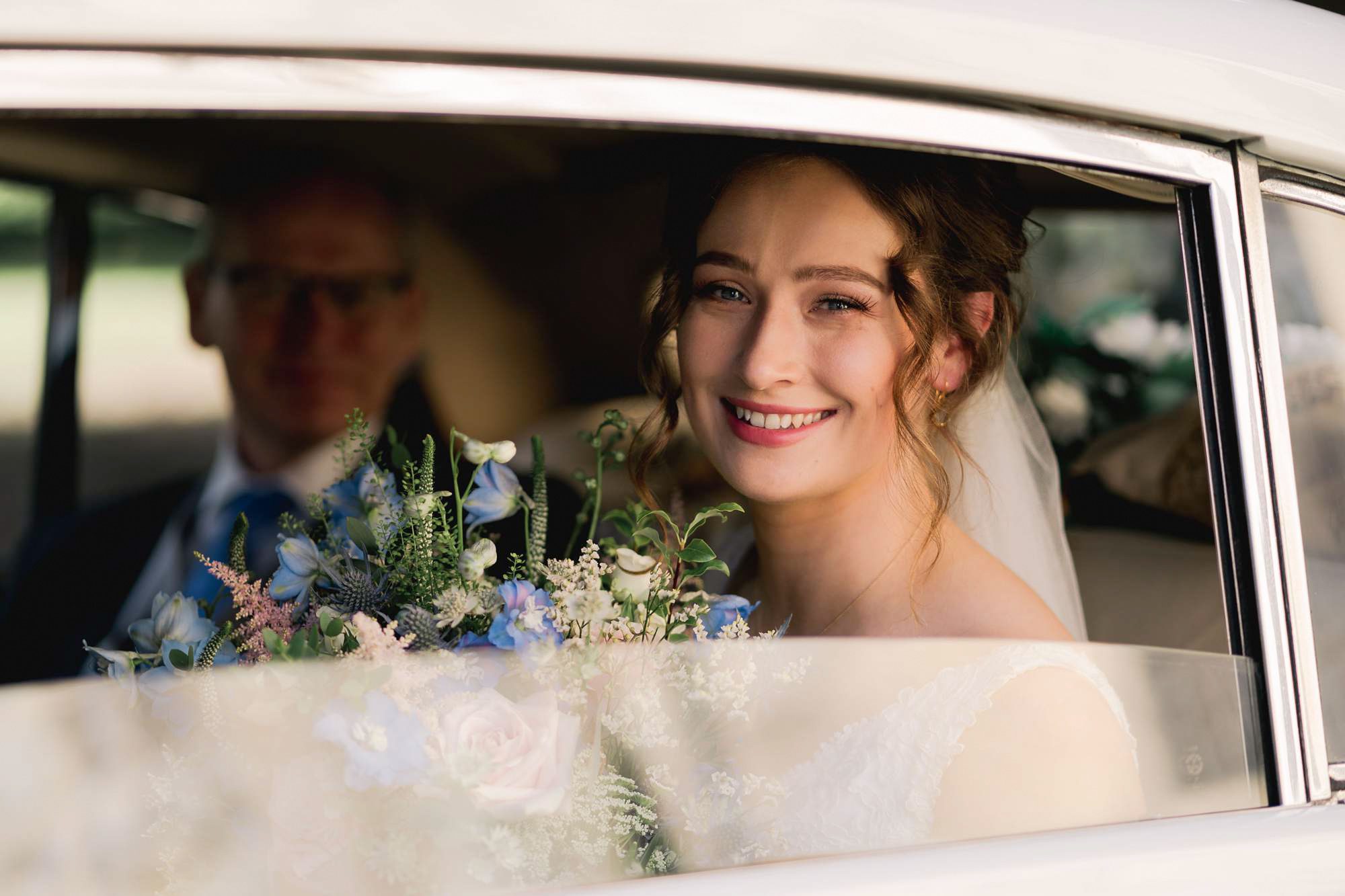 Bride arrives in a car at Salomons Estate in Tunbridge Wells.
