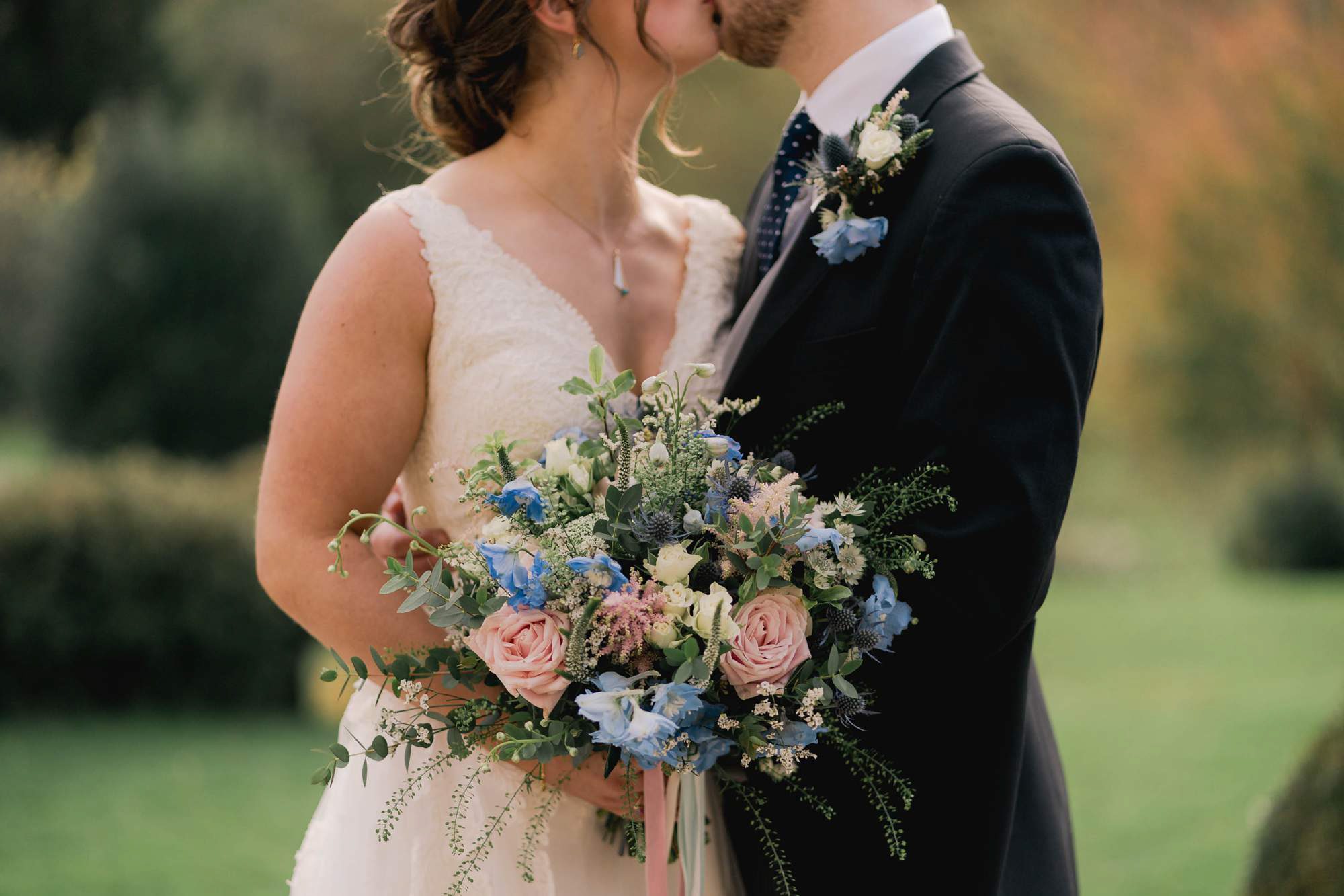 Bride and groom kiss on their wedding day at Salomons Estate in Tunbridge Wells.