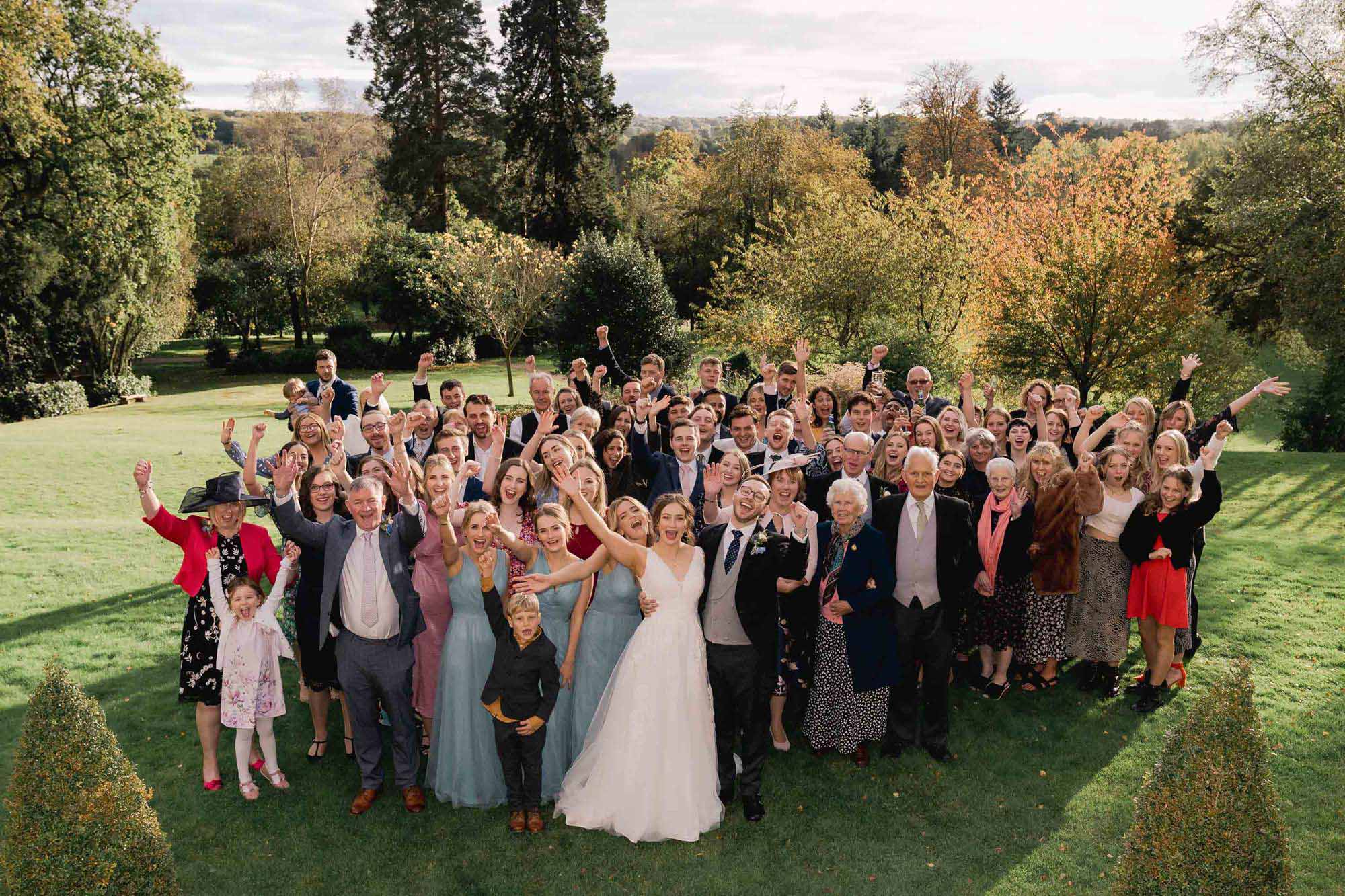 all the wedding guests cheer at Salomons Estate in Tunbridge Wells.