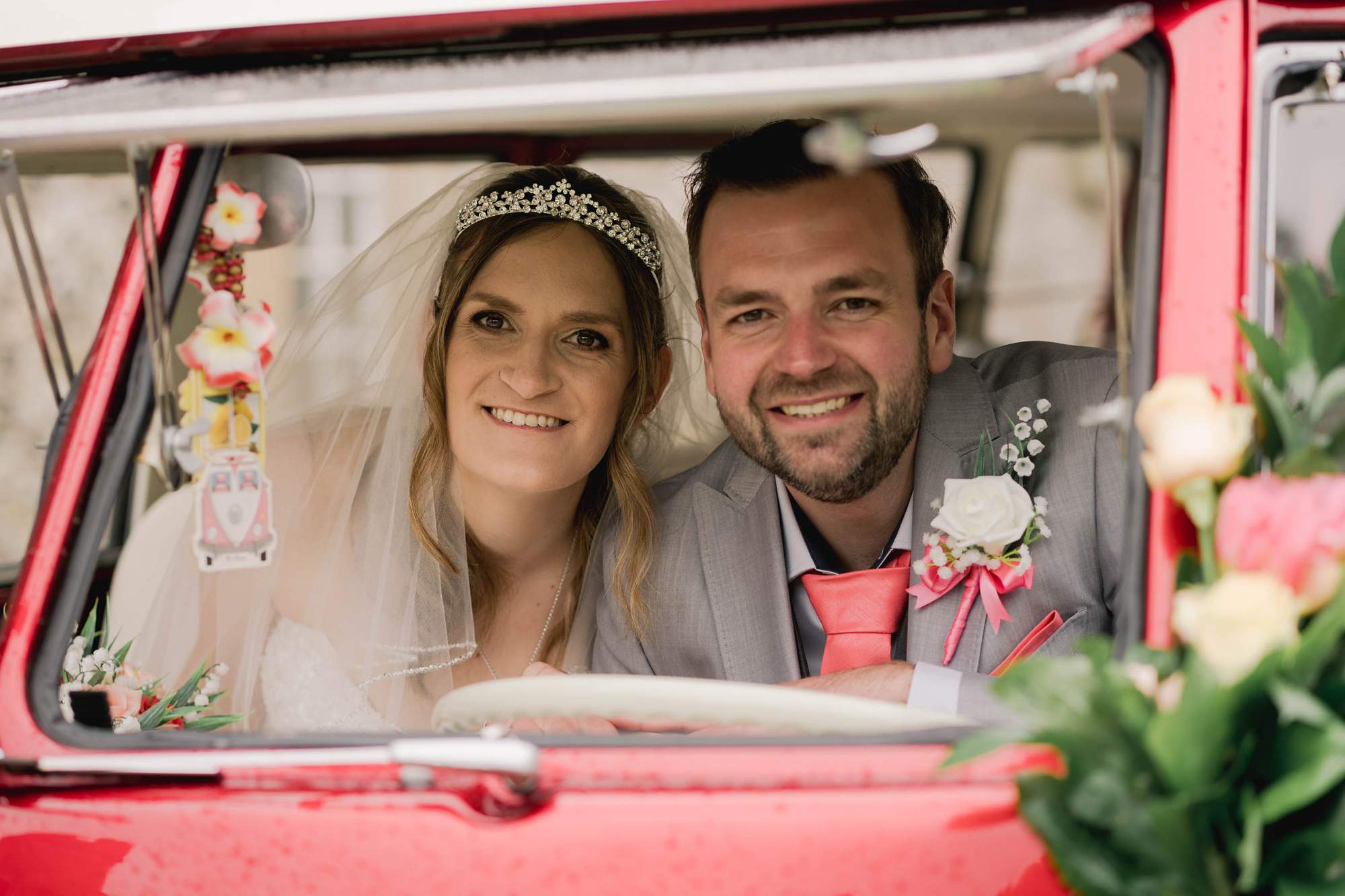 Bride and Groom in a campervan on their wedding day at Castle Goring in West Sussex.