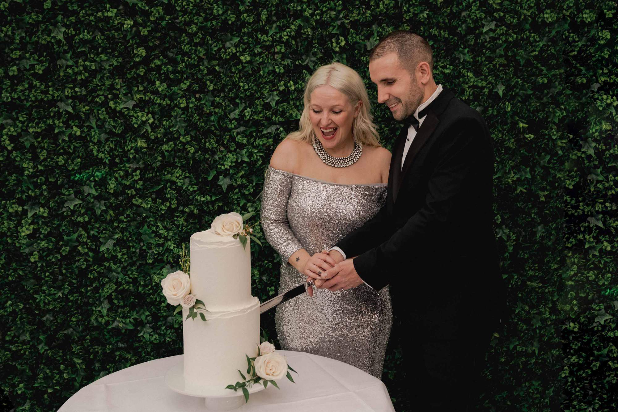 Newlyweds cut the cake at Stanhill Court in Surrey.