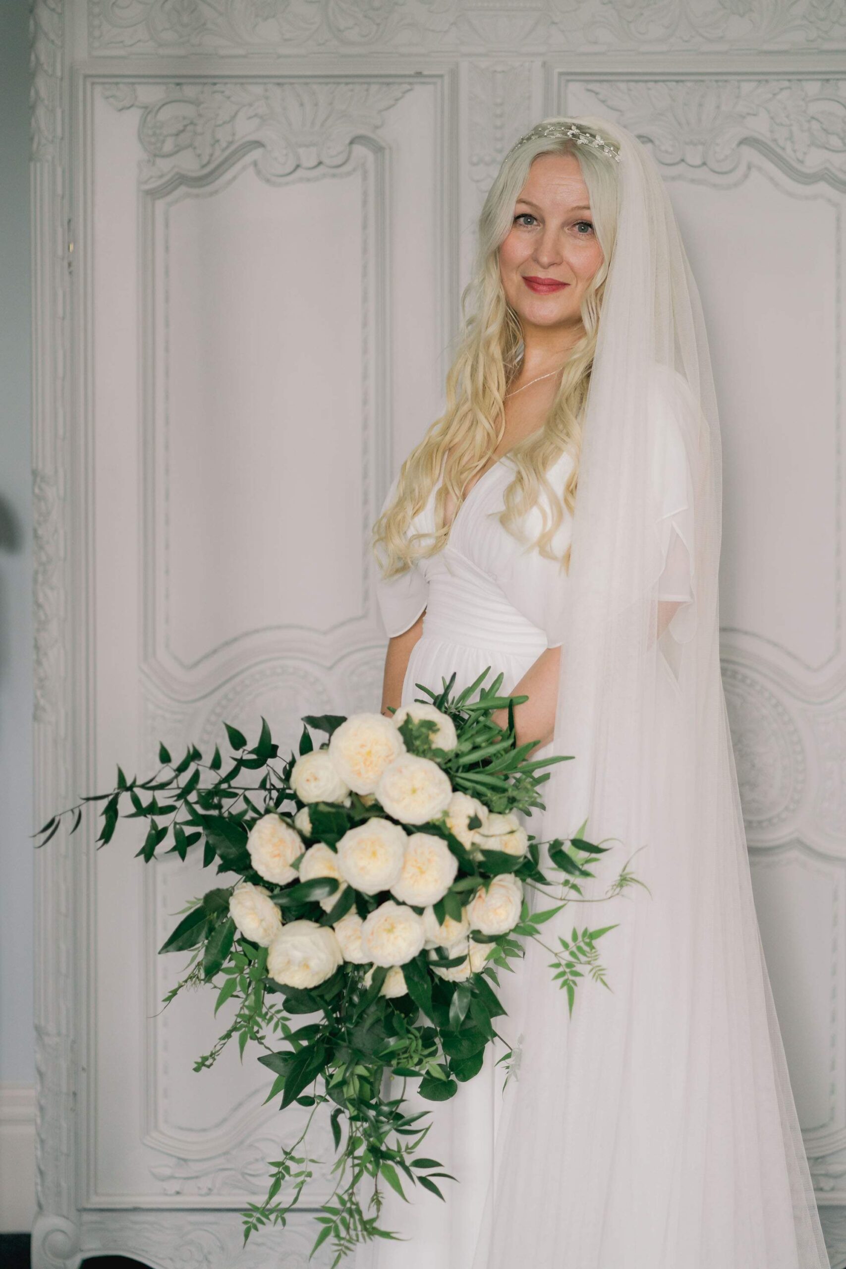 Bridal portrait with beautiful white bouquet of flowers at Stanhill court.