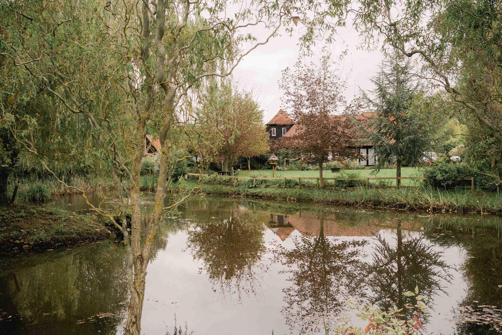 Pond and gardens at Rumbolds Farms wedding venue in Billingshurst, Sussex.