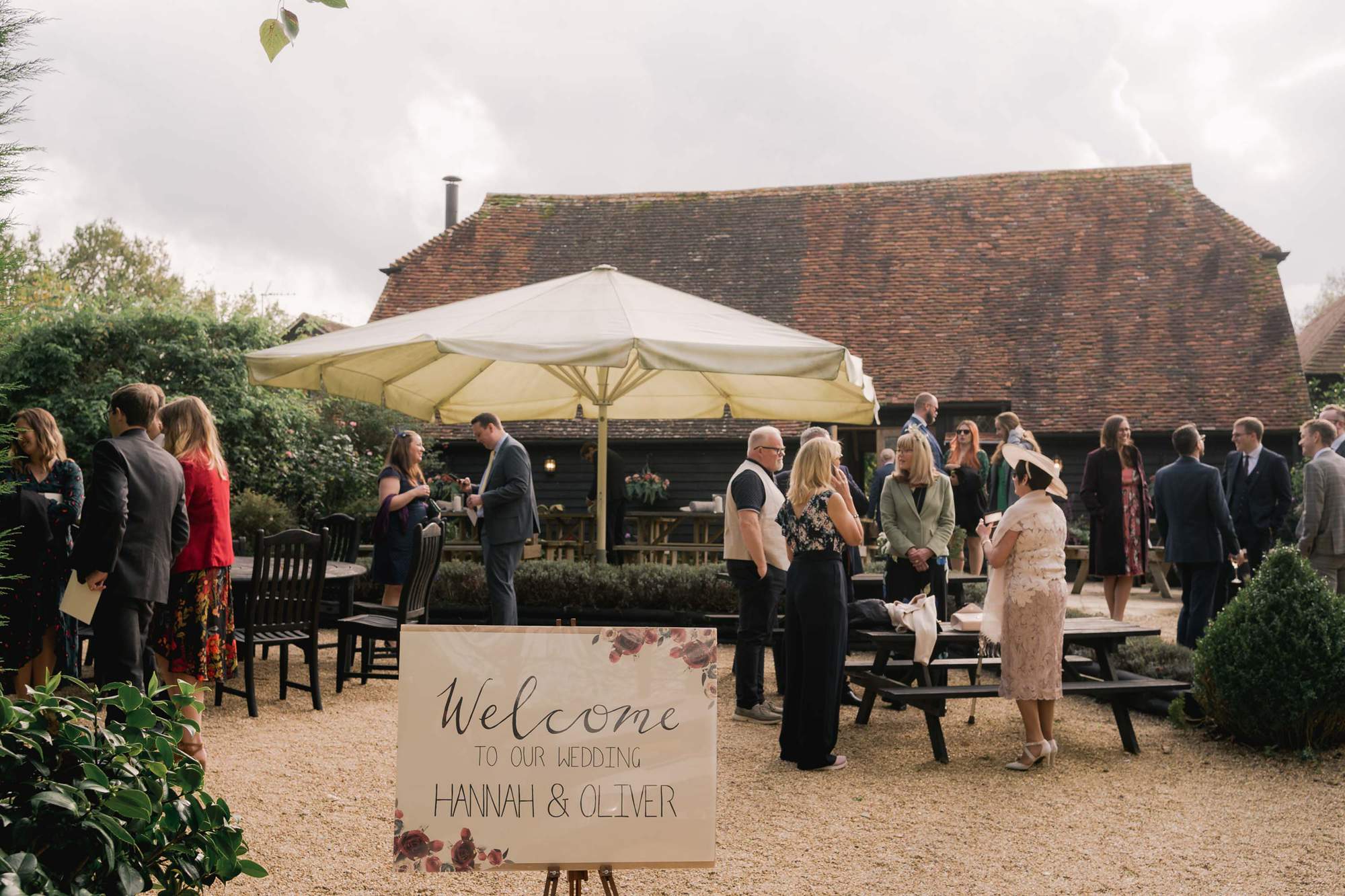 Wedding reception with guets mingling at Rumbolds Farms wedding venue in Billingshurst, Sussex.