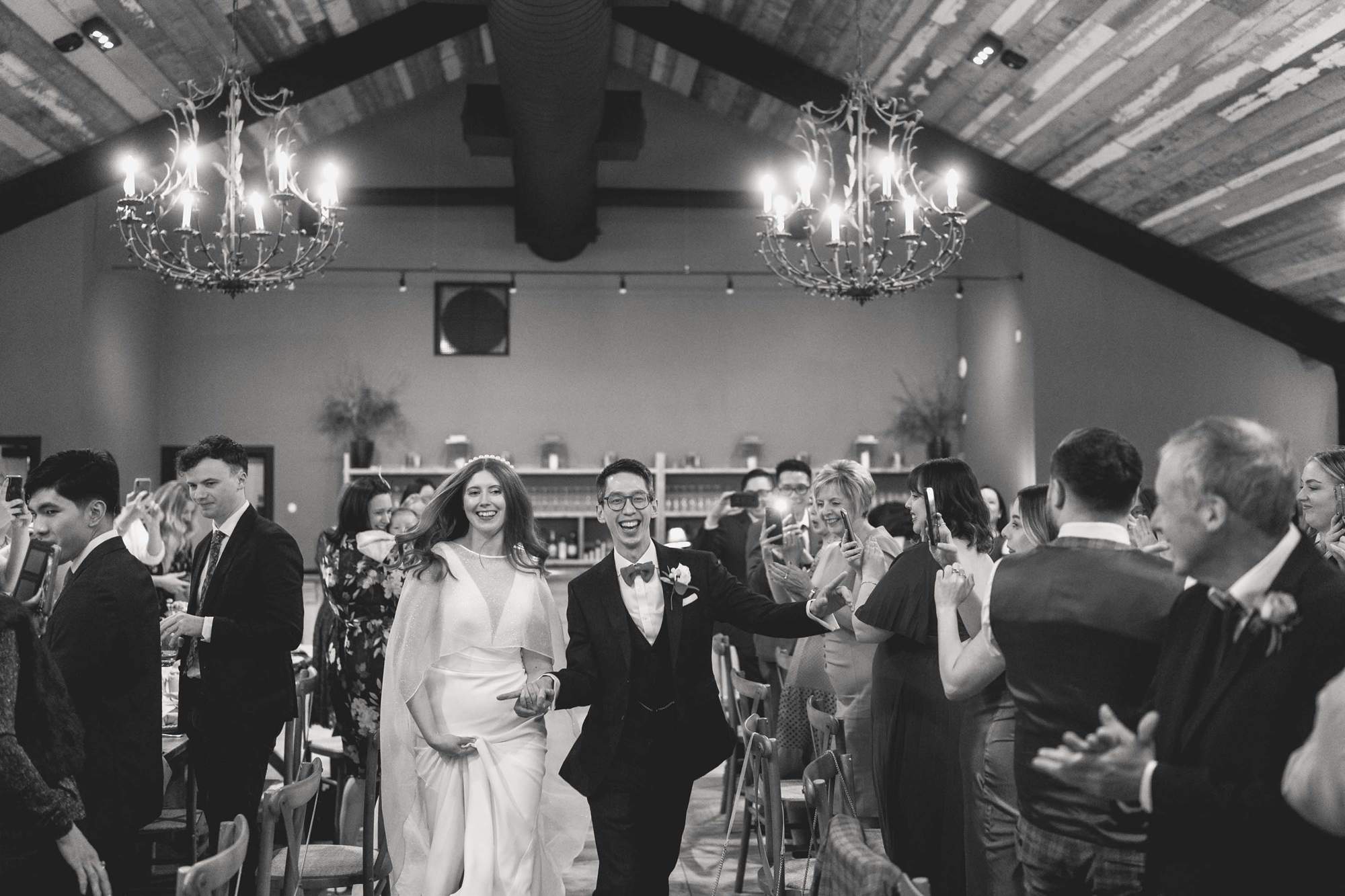 Newly wedded couple make an entrance at the Barn at Botley Hill.