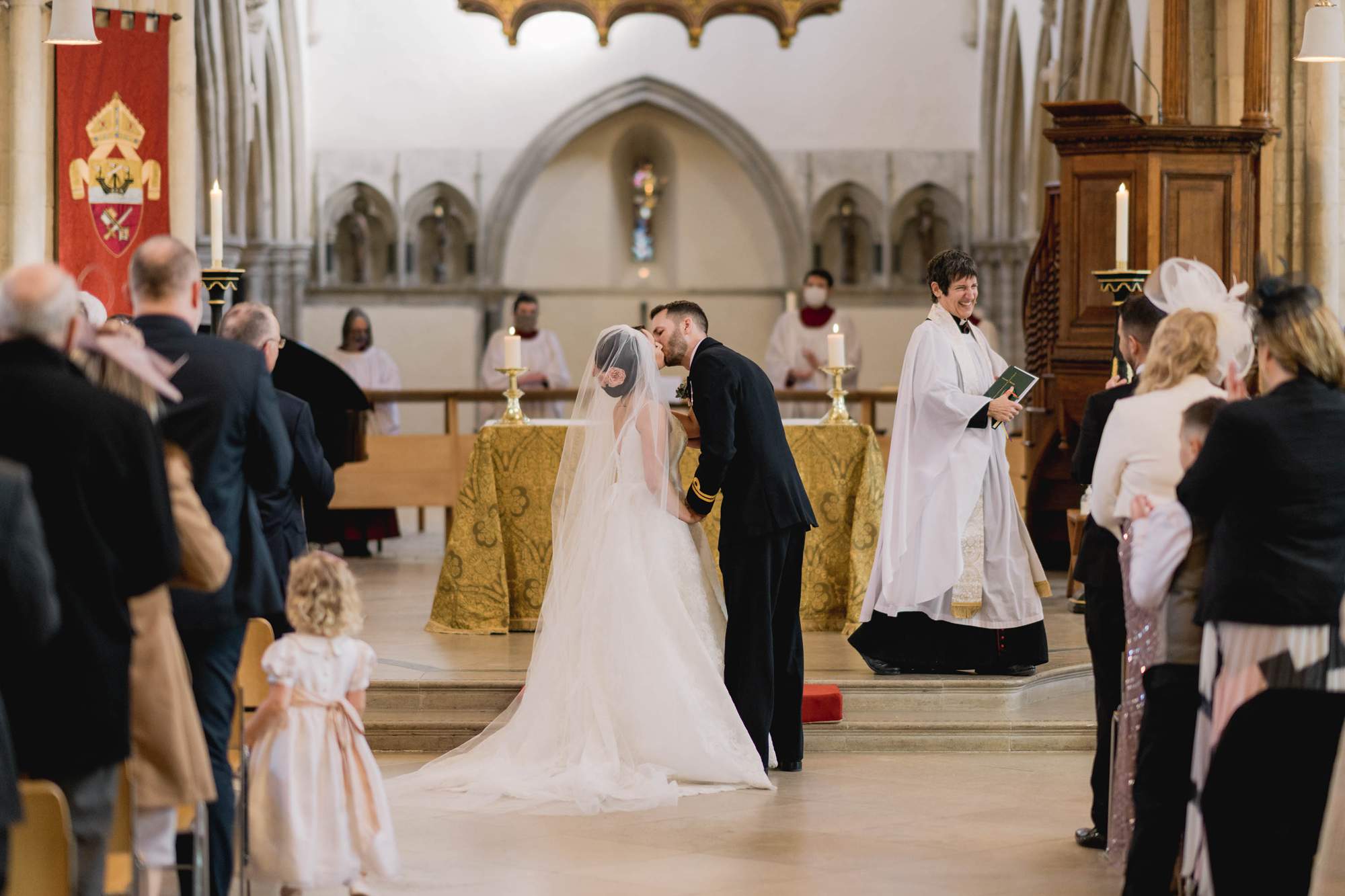 Bride and groom share a first kiss as husband and wife at Portsmouth Cathedral.