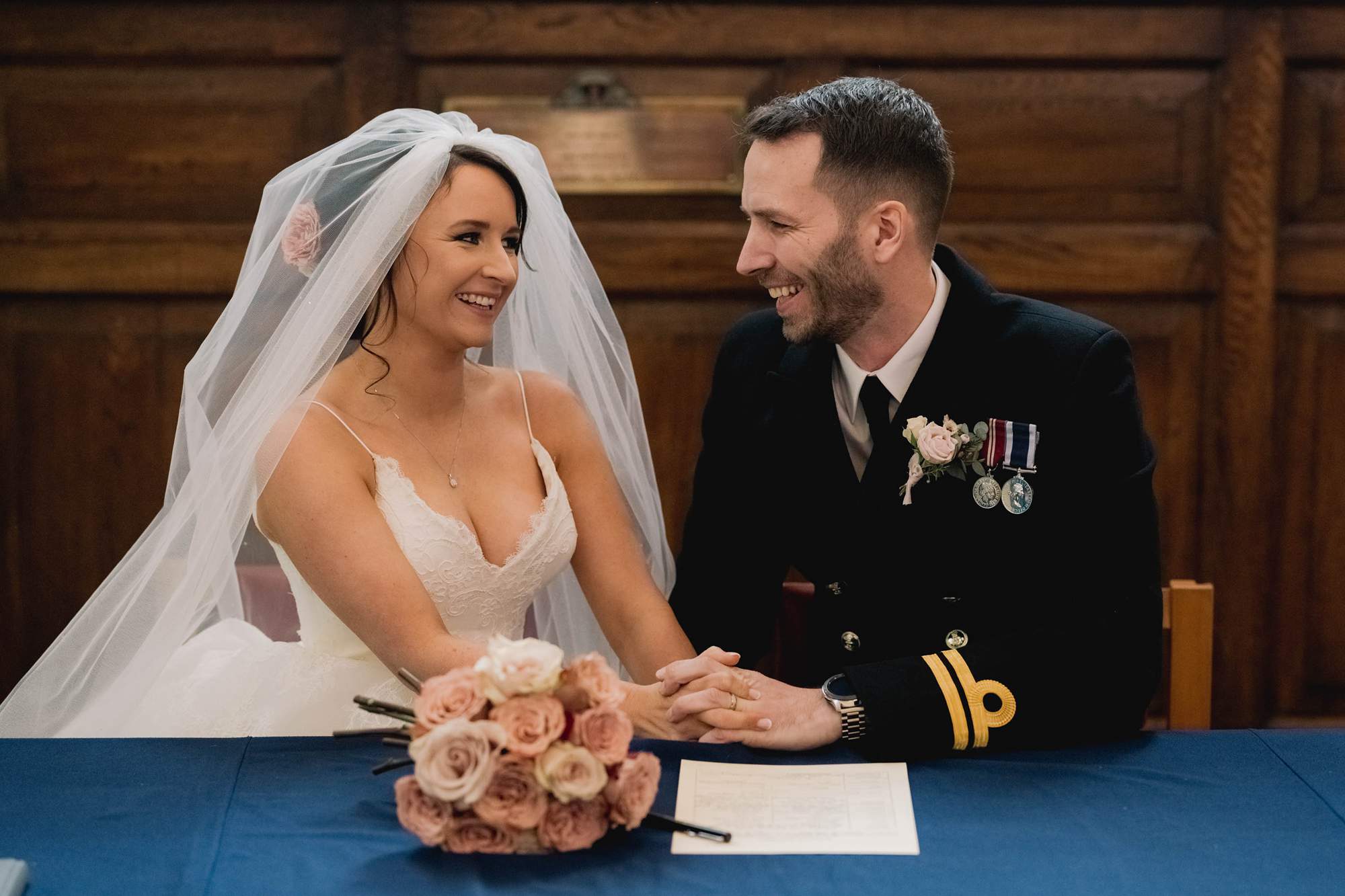 Bride and groom enjoy their Naval wedding at Portsmouth Cathedral.