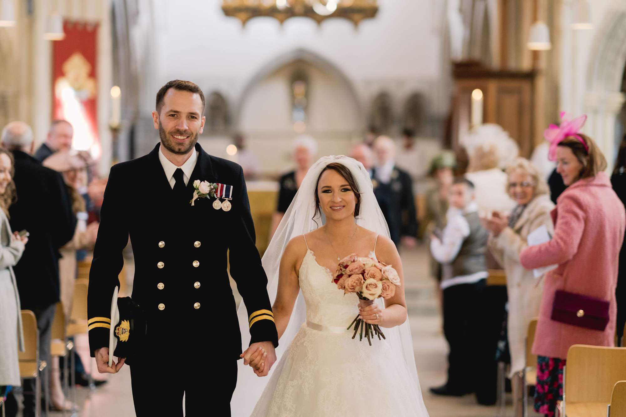 Bride and groom walk down the aisle at Portsmouth Cathedral.