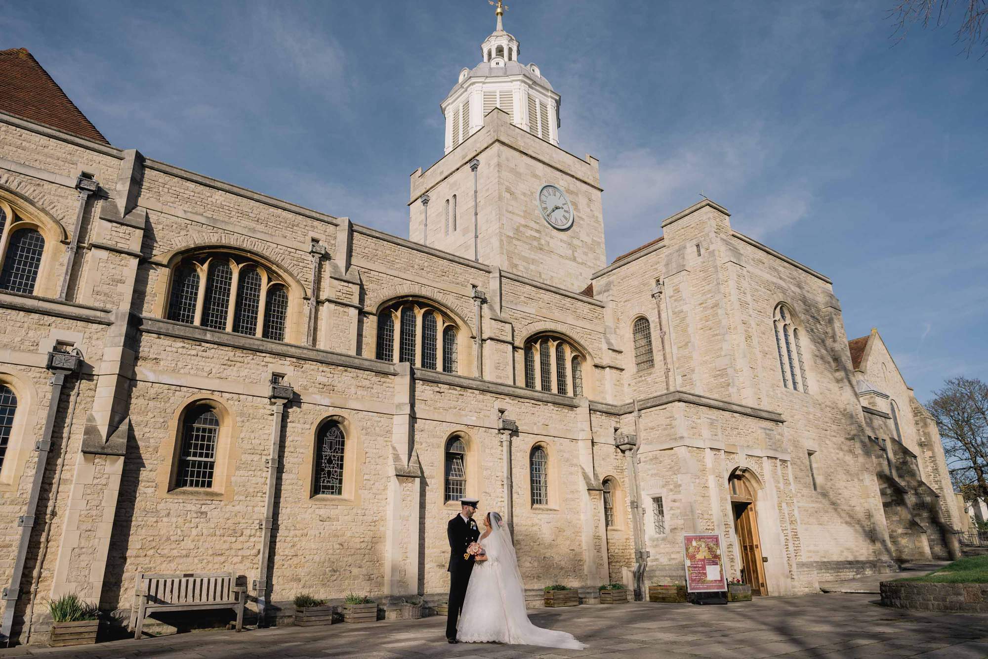 Bride and groom have a cuddle on their wedding day at Portsmouth Cathedral.