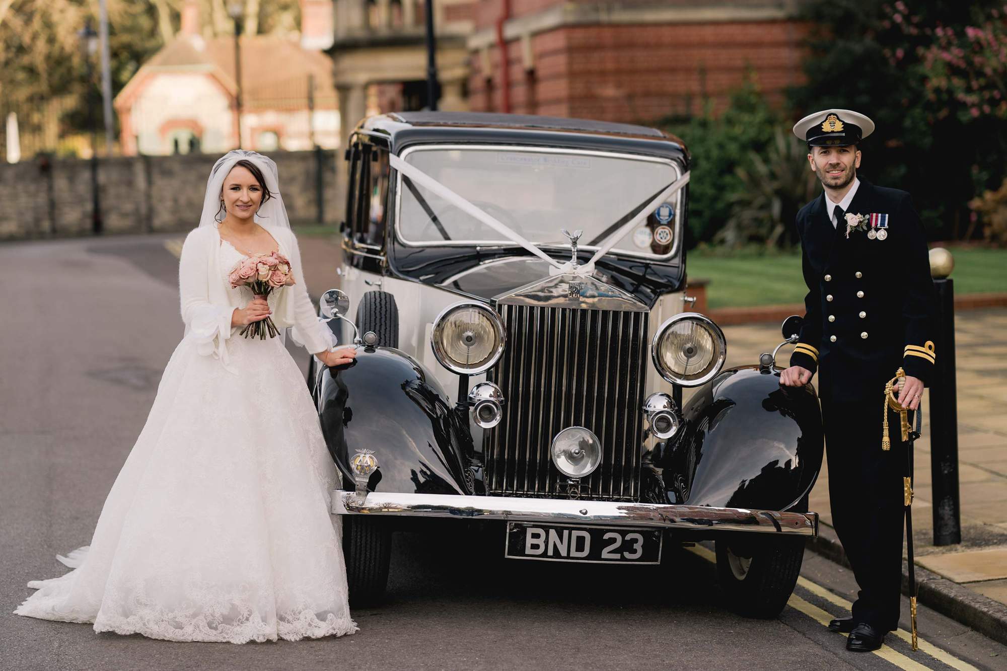 bride and Groom with their vintage Rolls Royce.