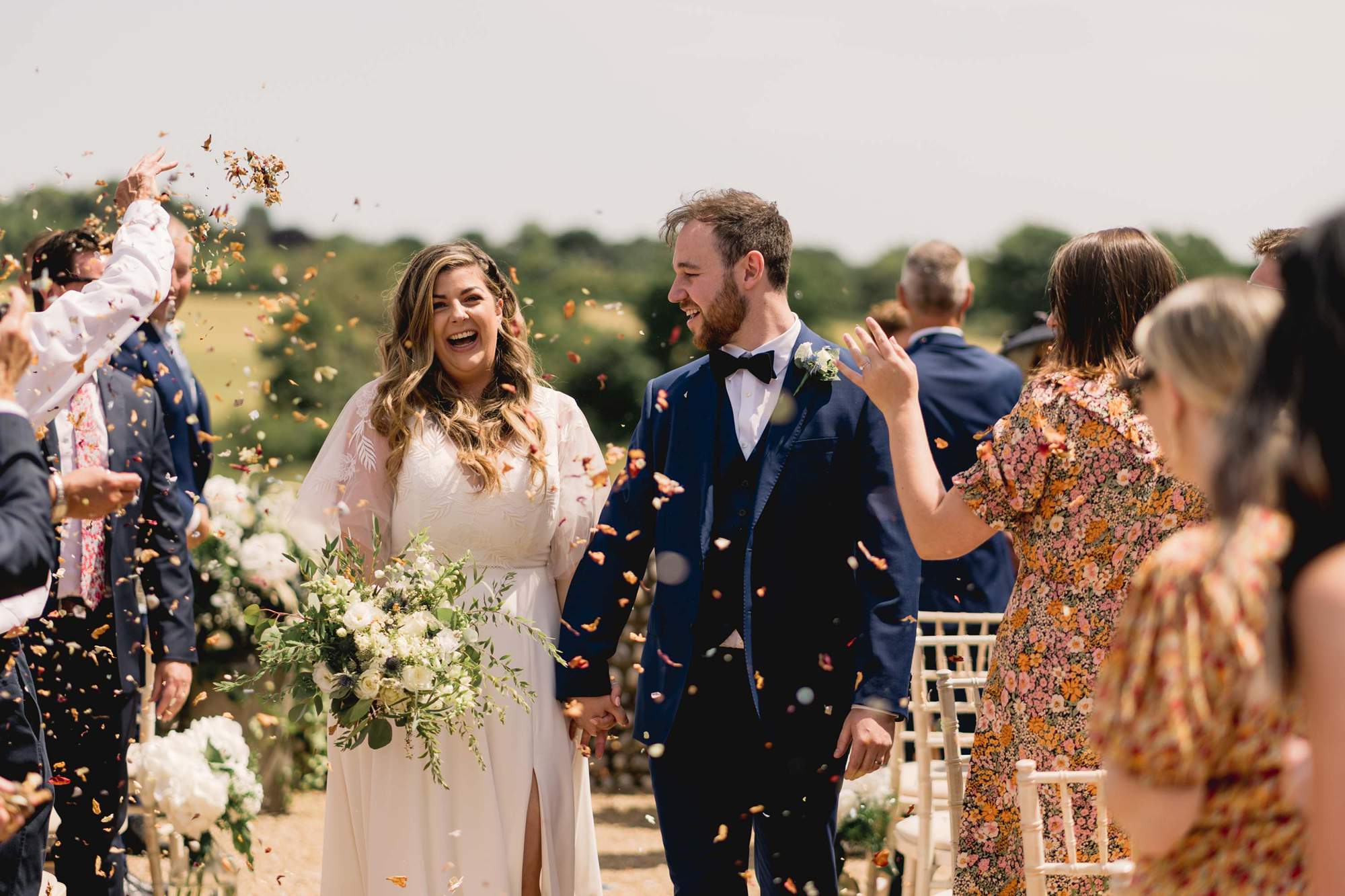 Confetti is throw at the Sussex Barn wedding venue in Hellingly.