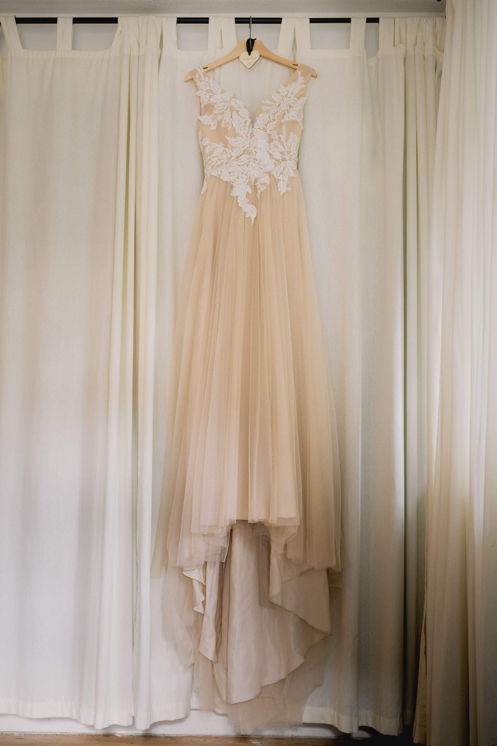 Bride's wedding dress that she will wear at her wedding ceremony at Eastbourne Town Hall.