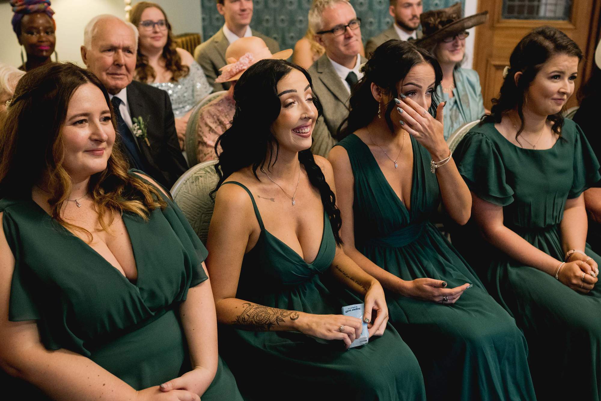 Bridesmaids shedding tears during the wedding ceremony at Eastbourne Town Hall.